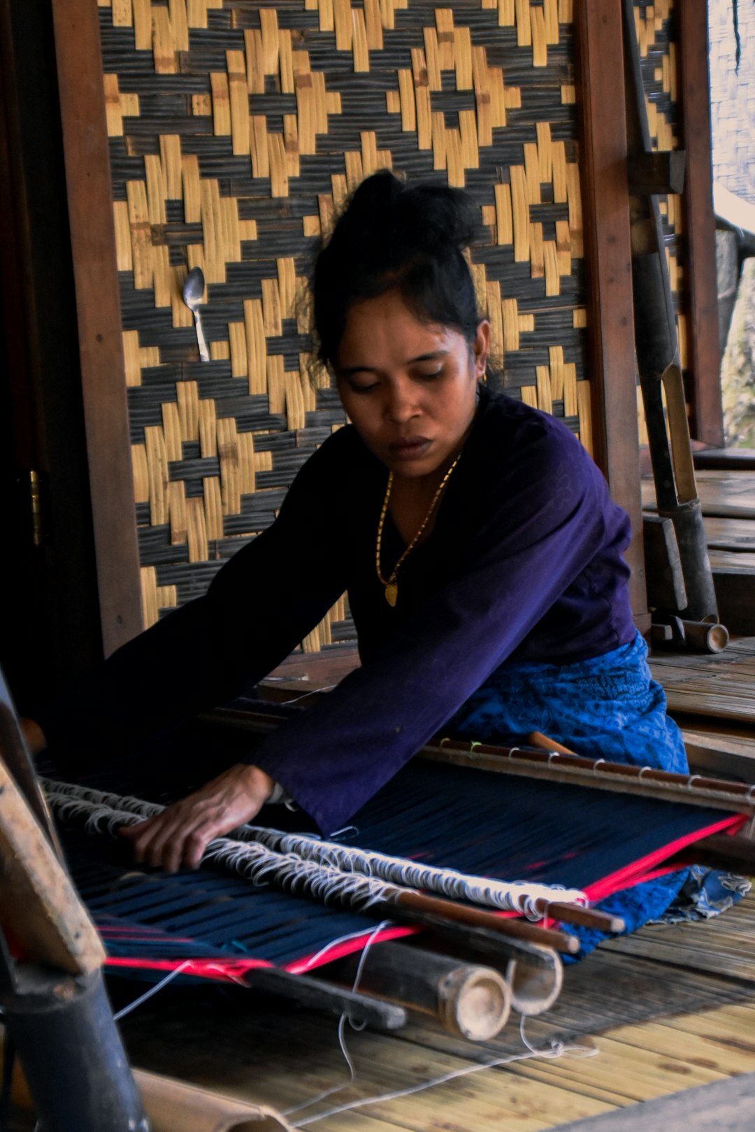 artisan weaving traditional blanket