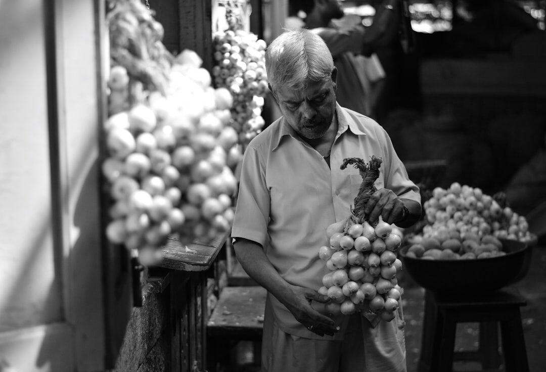 elderly woman selling fruit