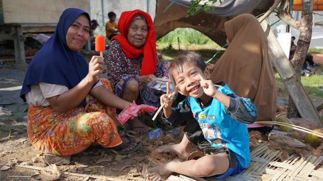 photographer with local family
