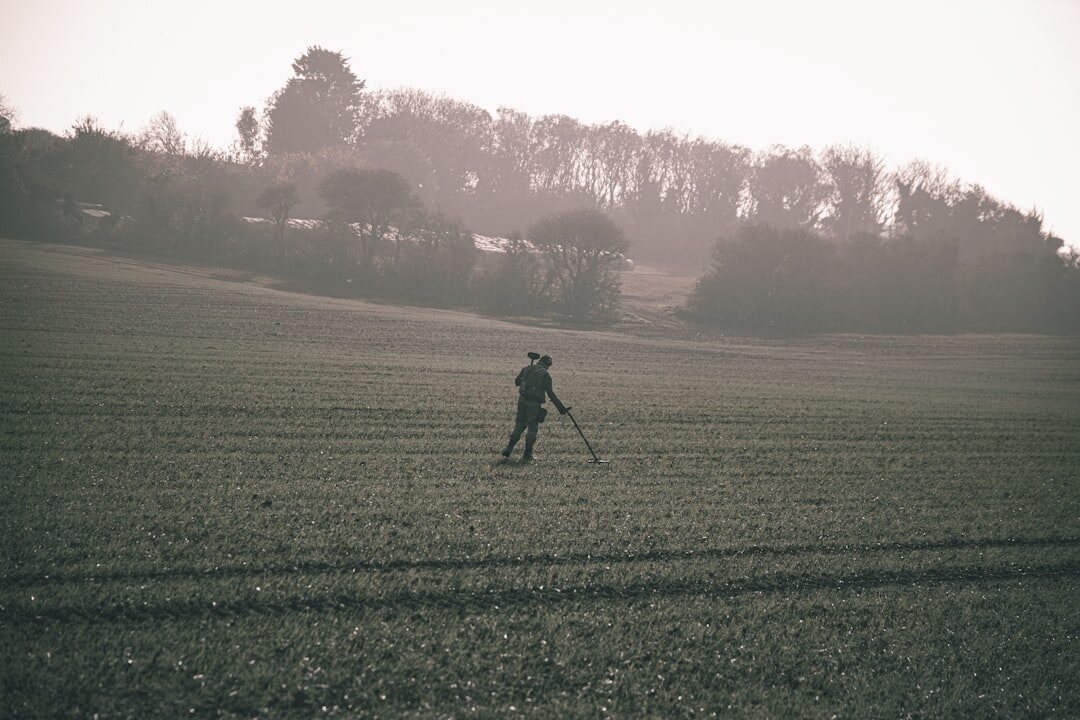 photographer with camera in field